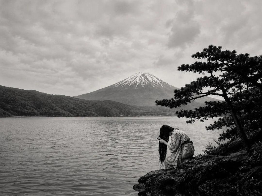 Mont Mizui mountain scene with Japanese woman performing hair care routine